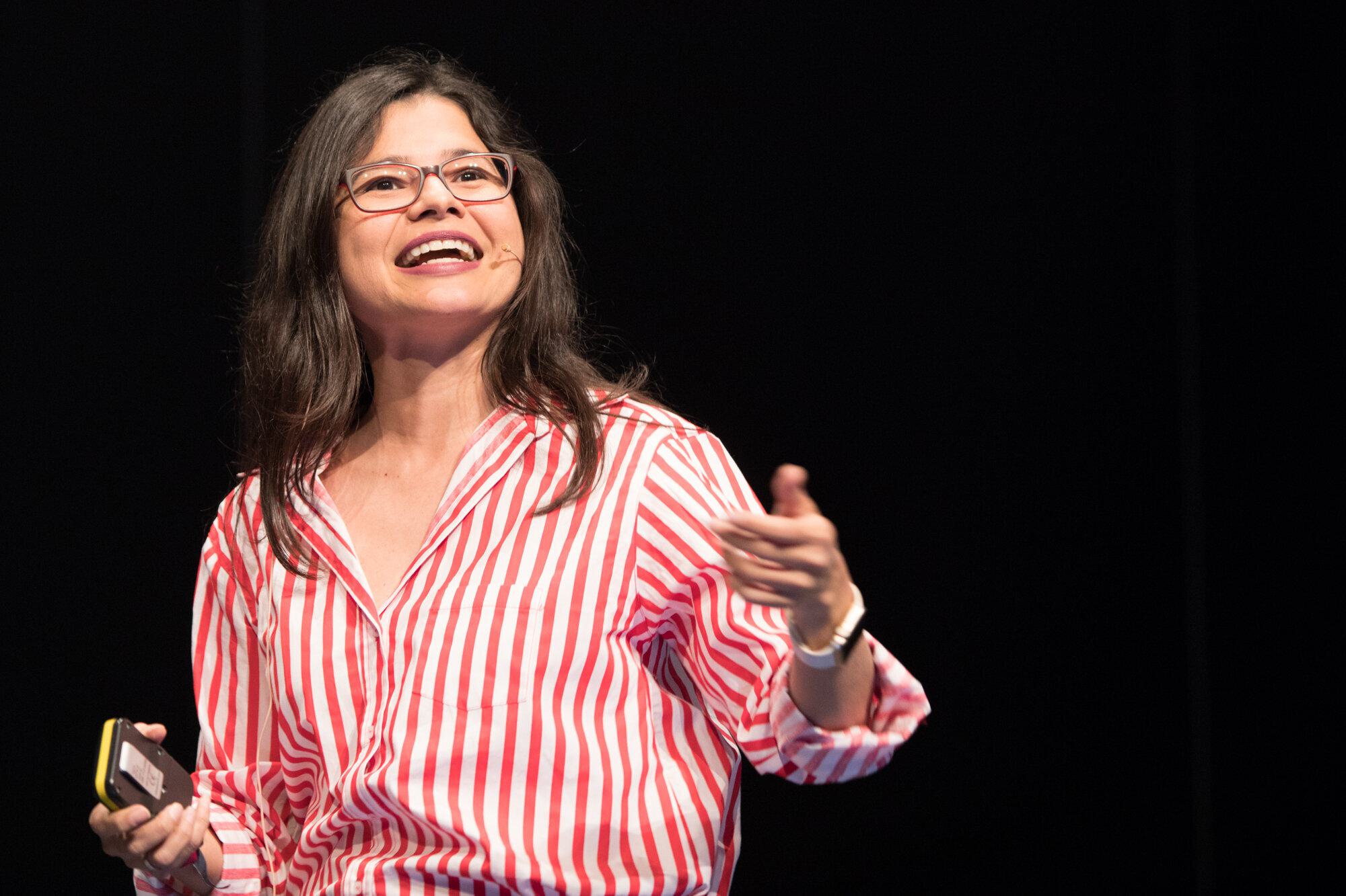 Aleyda Solis speaking on stage, representing a thought leader